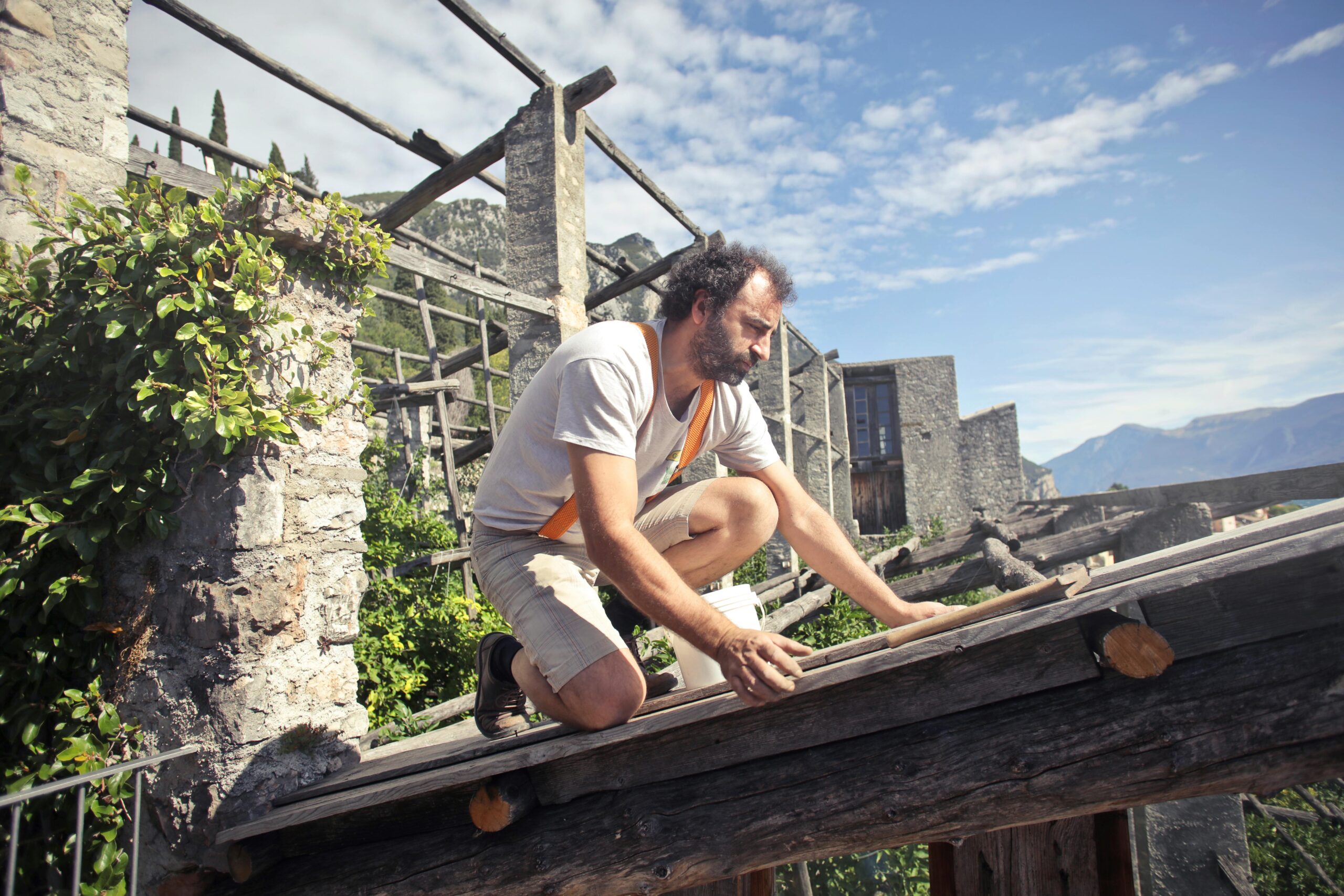 Person working on a wooden structure.
